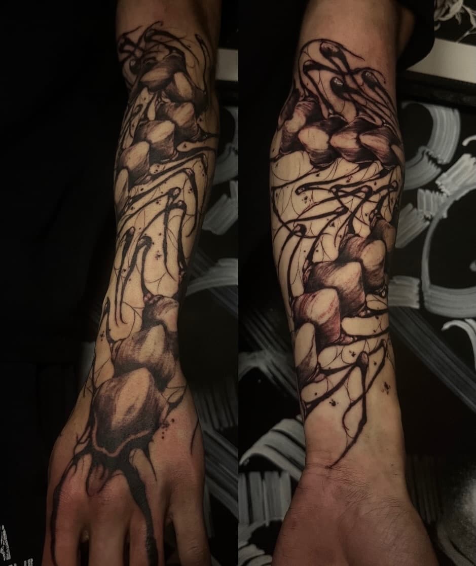 Two views of an organic blackwork quarter sleeve made of segmented shapes and thin whipped lines running onto the hand.